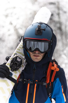 Portrait of a skier in a helmet and goggles