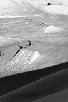 Skier jumping on ramp in ski park