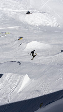 Freestyle skier in ski park jumping
