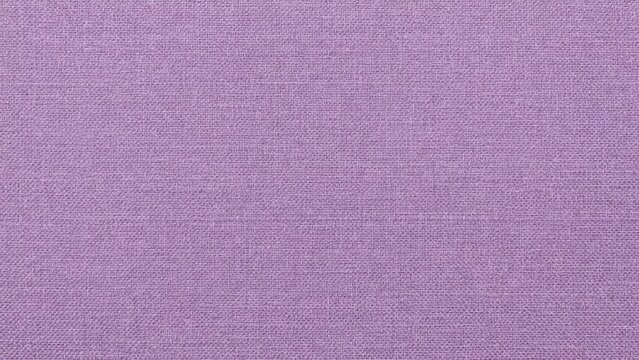 Delicate lilac fabric texture with subtle interwoven pattern and soft color palette
