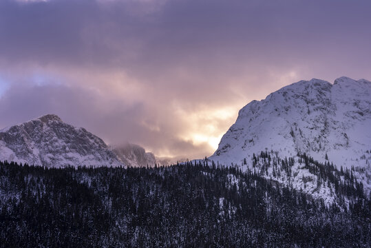 Mountain peak illuminated by a colorful winter sunset