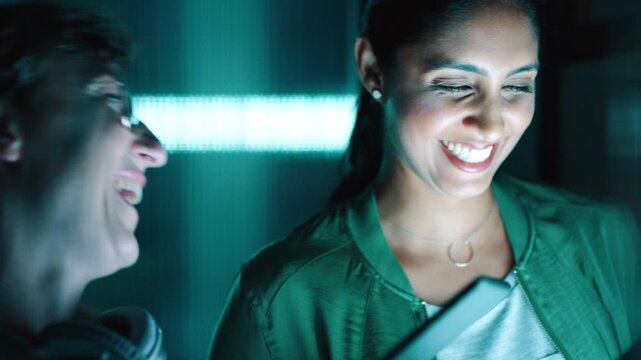 Night, people and laugh in office with tablet, funny idea or online trend for digital marketing project. Late, happy women and talk in workplace with tech, internet joke and teamwork for advertising.