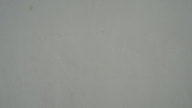 Abstract textured gray background with subtle speckles and soft lighting