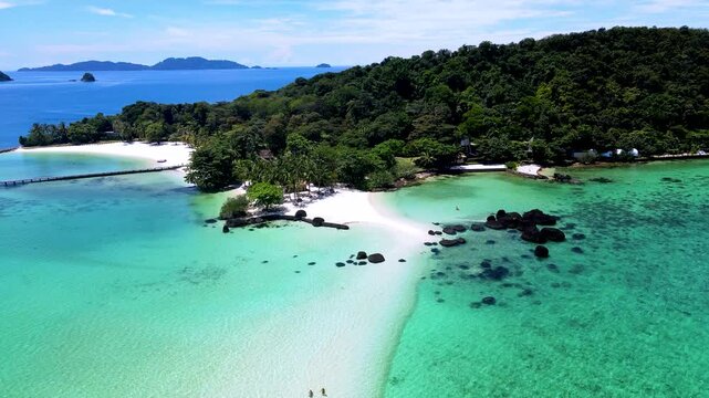 Explore the enchanting beauty of Koh Kham in Trat, Thailand, where white sandy beaches meet turquoise waters. Relax in a tropical paradise surrounded by lush greenery and vibrant marine life.