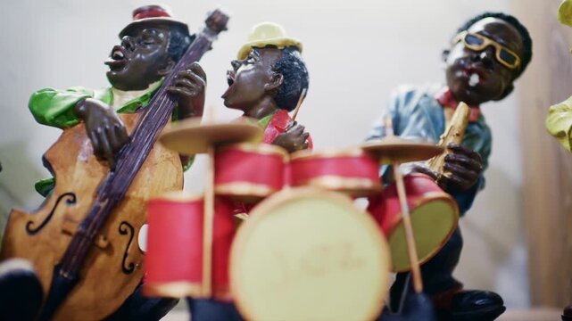Decorative jazz band figurines playing instruments including drums and double bass