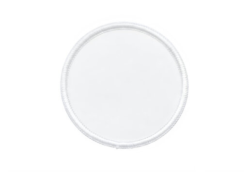 A circular white embroidered fabric patch with a stitched border for garment decoration purposes