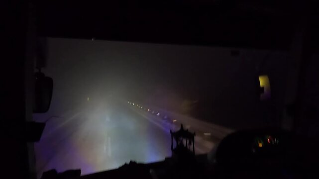 Driving Through Dense Fog at Night from Bus Interior, Low Visibility Winter Road Scene &ndash; 4K