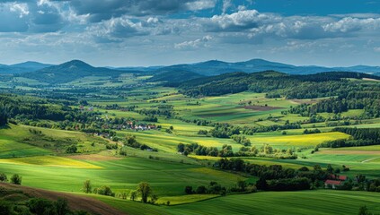 Fototapeta premium Rolling green hills under a dramatic cloudy sky in the countryside.