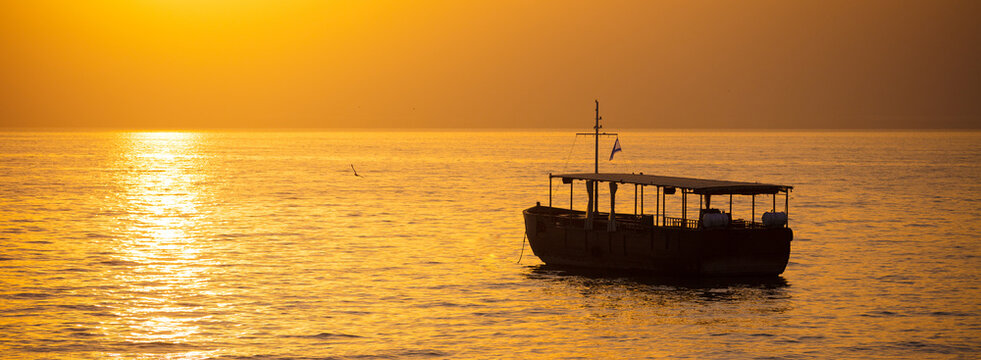 Beautiful Sea of Galilee in the morning. Golden sunrise over Kinneret