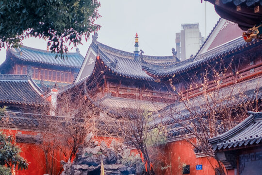 Traditional Chinese Temple Courtyard with Red Walls and Glazed Tile Roofs