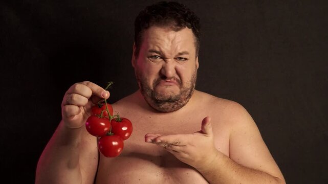 A funny fat man overeats tasty and unhealthy food.
