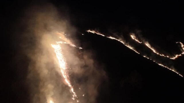 fire flames and smoke from brush fire in the sampson community near boone nc, north carolina