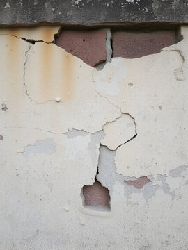 An old weathered wall shows signs of decay and age