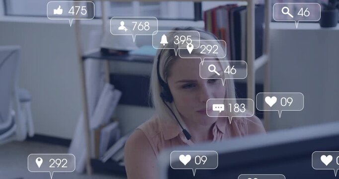 Support agent typing and speaking at desk, initiating social alerts growing as handling engagement