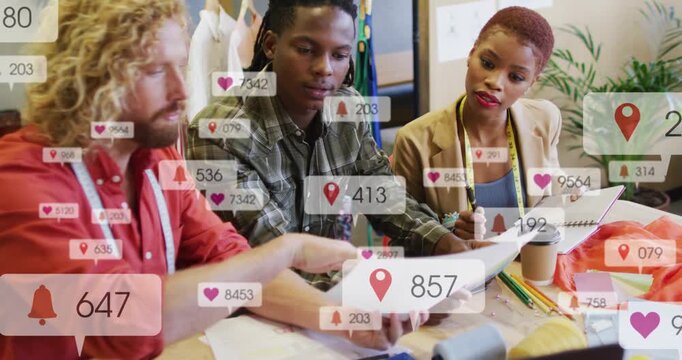 Design team pointing passing sketch, noting while hearts floating over table finalizing design