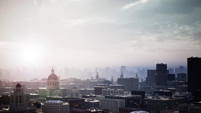 Sunrise skyline over sprawling cityscape bathed golden light, domed landmark and highrise towers recede into mist, soft lens flare creates cinematic glow,