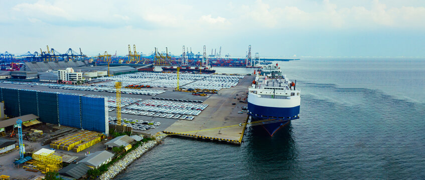 Aerial view ro-ro ship, Cargo ship transportation of business logistic sea freight, New Cars produced by year up in the port for Cargo ship and Cargo import-export around in the world