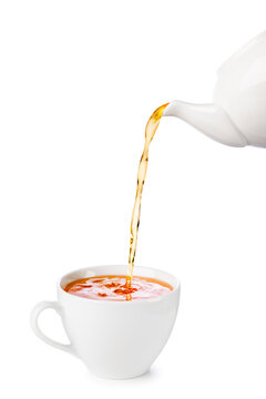 White cup of tea with teapot filling, isolated on white background.