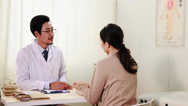 Physician herbalist traditional apothecary picks up a package of dried herbs and oriental doctor explaining treatment using pill, advice to patient instructions drug usage guide after check, treatment