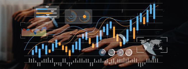 Business professionals engage in financial analysis with digital graphs showcasing growth metrics....