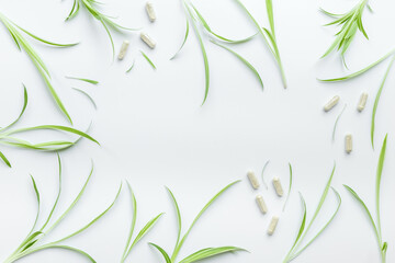 Obraz premium Alternative herbal medicine - herbs and pills on white. Homeopathy treatment, top view