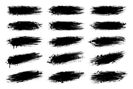 Collection of abstract black paint brush strokes with rough texture.