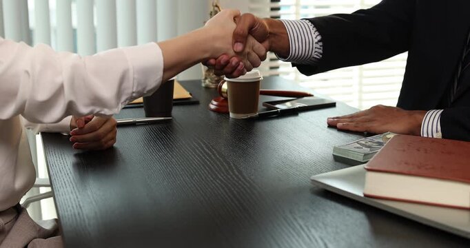 Close up of illegal money exchange between business people during a meeting, representing bribery, corruption, unethical behavior, and violation of law in professional environment.