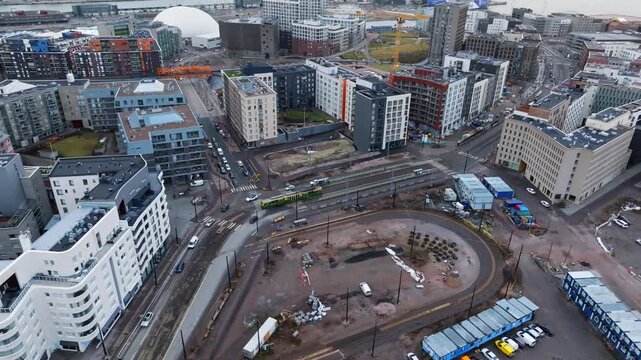 Helsinki Cityscape: Tram driving through urban redevelopment in J&auml;tk&auml;saari port area