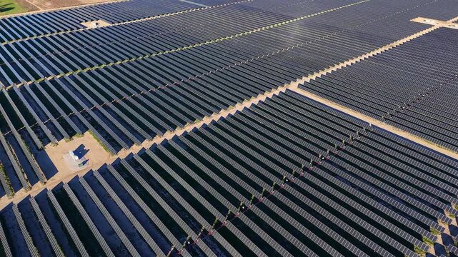 Solar farm generating clean electricity in Adrian, Michigan, USA, Vast solar panels capturing sunlight, producing renewable energy at a large power plant site