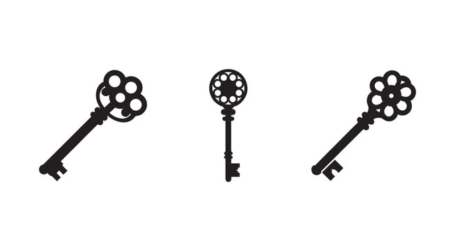 Three black antique keys with decorative floral heads and circular holes isolated on white background