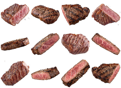 Collection of perfectly grilled medium-rare beef steaks seasoned with salt and pepper.