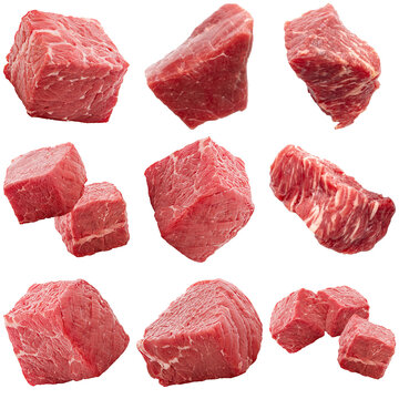Photograph of fresh, raw beef cubes, perfect for stew or goulash, isolated on a transparent background.