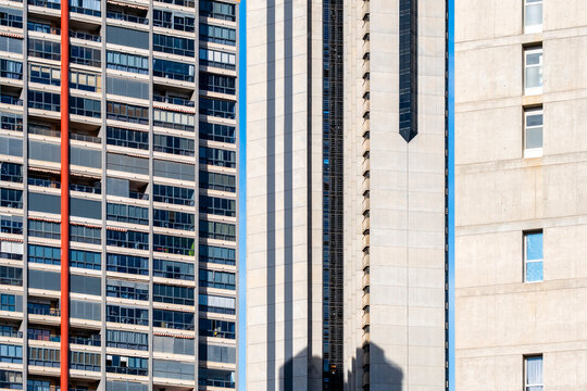 Modern urban architecture details show Benidorm Spain facade with windows lines pattern and shadow forming a graphic city texture of coastal housing