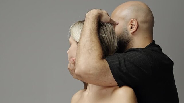 Therapist performing craniosacral and facial massage techniques on a calm female client, gently repositioning the head and applying pressure to the neck and face.