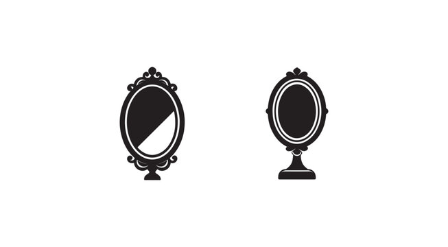 Two black and white ornate mirrors on stands with intricate designs and oval shapes  reflecting nothing
