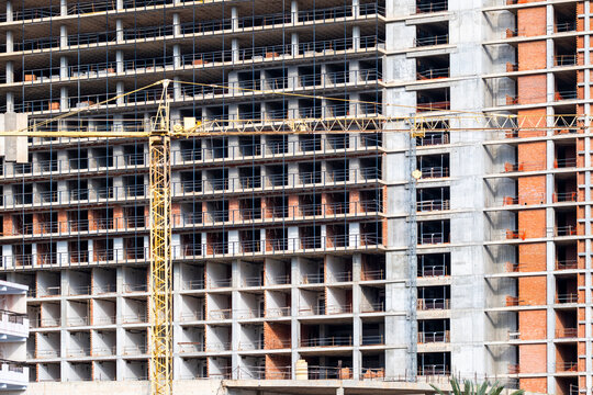 Documentary urban construction building structure with concrete scaffold facade renovation showing development progress in spain on an unfinished site