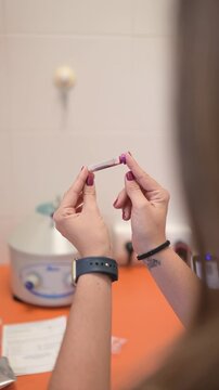 Veterinarian preparing a blood sample for analysis
