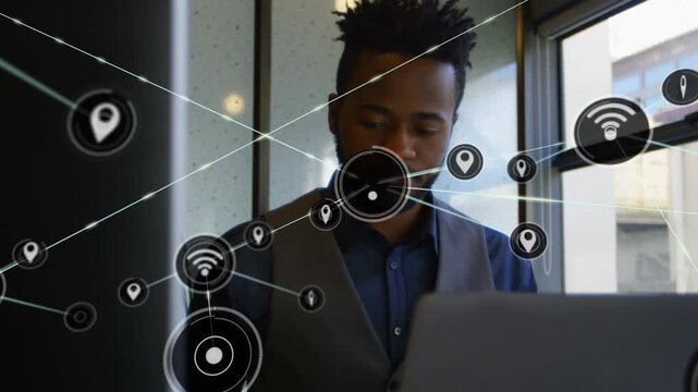 Animation of network of connections with icons over caucasian businessman using vr headset