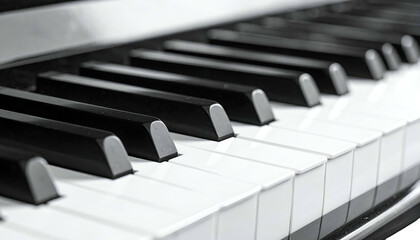 Naklejka premium Close-up, piano keys alternating black & white, glossy surface