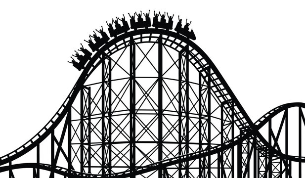 Silhouette of a roller coaster with riders at the top of a hill