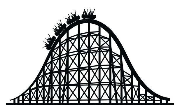 Silhouette of a classic wooden roller coaster with riders in silhouette