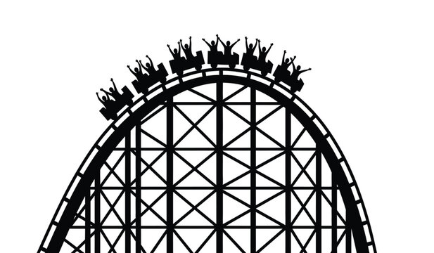 Silhouette of a roller coaster with riders cresting the top of a hill
