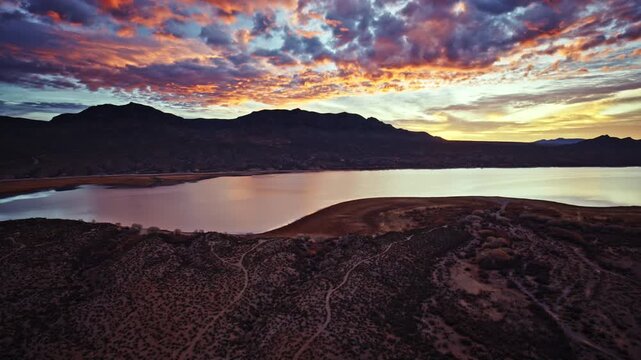 Drone footage of golden sunrise tones washing over Caballo Lake State Park in New Mexico.