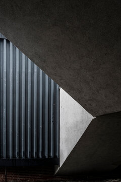 Concrete architecture corridor in modern minimal style where triangle geometry and shadow build dramatic texture contrast for conceptual space
