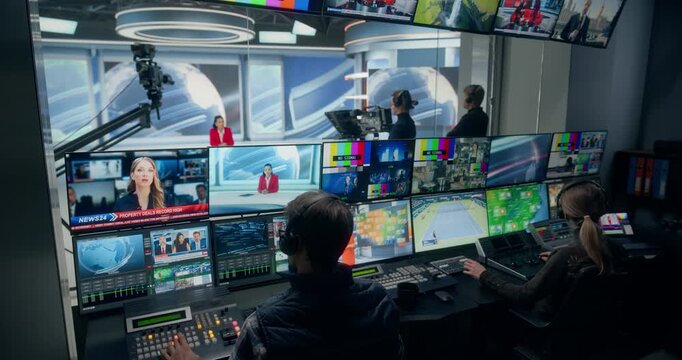 Backstage TV Station Production Control Room Shows Operators Switching Live Newsroom Feeds, Monitoring Screens, Cueing Studio Cameras, Coordinating Anchor Broadcast Television Channel 
