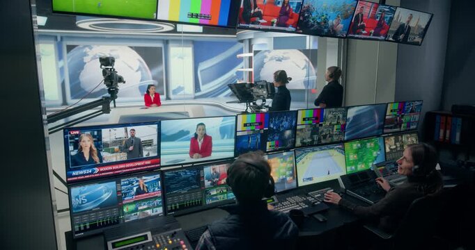 Backstage TV Station Production Control Room: Operators Switching Live Newsroom Feeds Channels, Sport, Weather, Entertainment on Monitoring Screens. Broadcast Television Network Cable Channel 