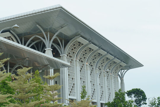 Side view of the Tuanku Mizan Zainal Abidin Mosque, also known as the Iron Mosque, showcasing its modern Islamic architectural design in Putrajaya, Malaysia.