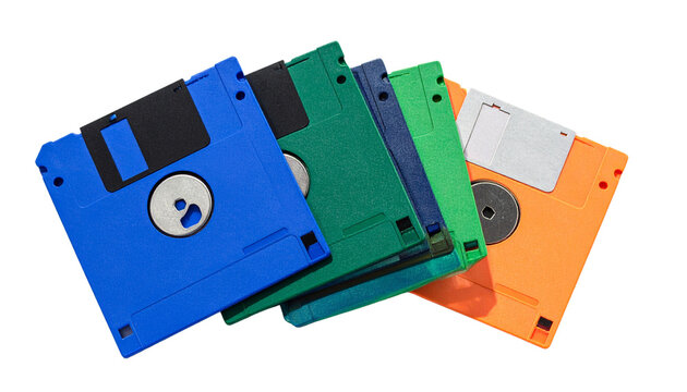 Stack of floppy disks in different colours, isolated on white background