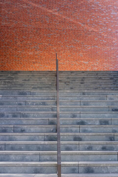 Concrete stairs and steps with brick texture showing minimal lines geometry and symmetry as modern background with clean copy space template