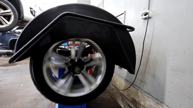 The process of balancing a car wheel using an electronic balancer